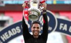 Arsenal's head coach Mikel Arteta lifts the trophy after the FA Cup final soccer match between Arsenal and Chelsea at Wembley stadium in London, England, Saturday, Aug.1, 2020. (Catherine Ivill/Pool via AP)