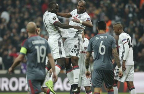 Besiktas' Ryan Babel, center right, celebrates after scoring against Olympiakos with his teammate Vincent Aboubakar, center left, during a Europa League round of 16 second leg soccer match between Besiktas and Olympiakos, in Istanbul, Thursday, March 16, 2017. Besiktas won the match 4-1 and was qualified. (AP Photo/Emrah Gurel)