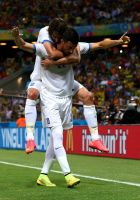 FORTALEZA, BRAZIL - JUNE 24:  Andreas Samaris (front) of Greece celebrates scoring his team's first goal with his teammate Giorgos Samaras during the 2014 FIFA World Cup Brazil Group C match between Greece and Cote D'Ivoire at Estadio Castelao on June 24, 2014 in Fortaleza, Brazil.  (Photo by Alex Livesey - FIFA/FIFA via Getty Images)