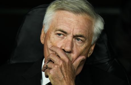Real Madrid's head coach Carlo Ancelotti sits in the bench prior the Champions League group F soccer match between Real Madrid and Leipzig at the Santiago Bernabeu stadium in Madrid, Wednesday, Sept. 14, 2022. (AP Photo/Manu Fernandez)