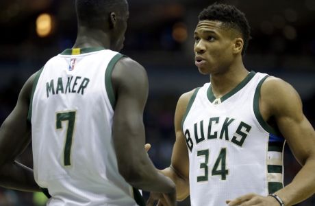 Milwaukee Bucks' Giannis Antetokounmpo (34) talks with Thon Maker (7) during the first half of an NBA basketball game against the Minnesota Timberwolves Saturday, March 11, 2017, in Milwaukee. (AP Photo/Aaron Gash) 