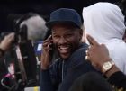 Boxer Floyd Mayweather Jr. talks on the phone during the second half of an NBA basketball game between the Los Angeles Lakers and the Minnesota Timberwolves on Thursday, Jan. 24, 2019, in Los Angeles. The Timberwolves won 120-105. (AP Photo/Mark J. Terrill)