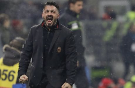 AC Milan coach Gennaro Gattuso celebrates his side's 2-1 win, at the end of the Serie A soccer match between AC Milan and Bologna, at the San Siro stadium in Milan, Italy, Sunday, Dec. 10, 2017. (AP Photo/Luca Bruno)