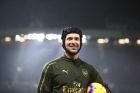 Arsenal's goalkeeper Petr Cech, who is a substitute in the game, walks onto the pitch prior to the English Premier League soccer match between Manchester United and Arsenal at Old Trafford stadium in Manchester, England, Wednesday Dec. 5, 2018. (AP Photo/Dave Thompson)