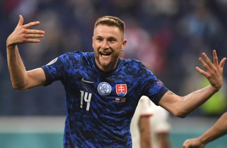 Slovakia's Milan Skriniar celebrates after scoring his side's second goal during the Euro 2020 soccer championship group E match between Poland and Slovakia at Gazprom arena stadium in St. Petersburg, Russia, Monday, June 14, 2021. (Kirill Kudryavtsev/Pool via AP)