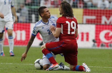 Greece's Jose Cholebas, left, and Czech Republic's Petr Jiracek fight during the Euro 2012 soccer championship Group A match between Greece and Czech Republic in Wroclaw, Poland, Tuesday, June 12, 2012. (AP Photo/Thanassis Stavrakis) 
