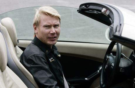 Finland's Mika Hakkinen, two-time Formula One champion, sits in a car during an exhibition in Quito, Monday, Oct. 20, 2008. Hakkinen is in Quito to promote Johnnie Walker whisky and campaign against drunk driving. (AP Photo/Dolores Ochoa)