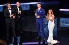 Real Madrid and Portugal's forward and winner of The Best FIFA Mens Player of 2016 Award Cristiano Ronaldo (L) poses on stage with his trophy next to (LtoR) co-host Marco Schreyl, FIFA president Gianni Infantino and co-host and US actress Eva Longoria during The Best FIFA Football Awards 2016 ceremony, on January 9, 2017 in Zurich. / AFP PHOTO / Fabrice COFFRINI