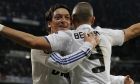 Real Madrid's Karim Benzema from France, right celebrates with Mesut Ozil from Germany after scoring against Lyon during a Round of 16, 2nd leg Champions League soccer match at the Santiago Bernabeu stadium in Madrid, Wednesday March 16, 2011. (AP Photo/Paul White)