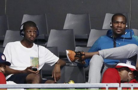 United States basketball players Paul George and Kevin Durant and the rest of basketball team, not pictures, watch boxing matches at Riocentro during the 2016 Summer Olympics in Rio de Janeiro, Brazil, Saturday, Aug. 13, 2016. (AP Photo/Frank Franklin II)