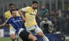 Inter Milan's Francesco Acerbi, left, and Porto's Mehdi Taremi vie for the ball during the Champions League, round of 16, first leg soccer match between Inter Milan and Porto, at the San Siro stadium in Milan, Italy, Wednesday, Feb. 22, 2023. (AP Photo/Luca Bruno)