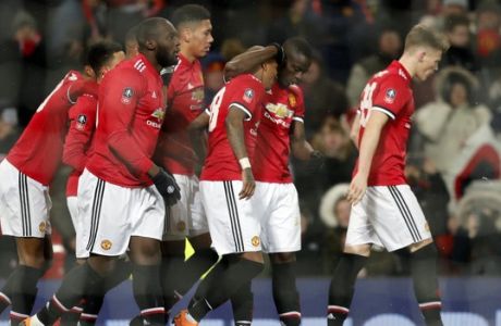 Manchester United players celebrate their second goal during the English FA Cup quarterfinal soccer match between Manchester United and Brighton, at the Old Trafford stadium in Manchester, England, Saturday, March 17, 2018. (AP Photo/Frank Augstein)
