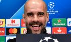 Manchester City manager Pep Guardiola smiles to the media during a press conference prior the Champions League round of 16, first leg, soccer match between FC Schalke 04 and Manchester City in Essen, Germany, Tuesday, Feb. 19, 2019. (AP Photo/Martin Meissner)