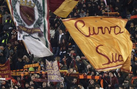 Roma supporters celebrate their team's victory at the end of the group C Champions League soccer match between Roma and Qarabag at the Stadio Olimpico in Rome, Italy, Tuesday, Dec. 5, 2017. (AP Photo/Alessandra Tarantino)