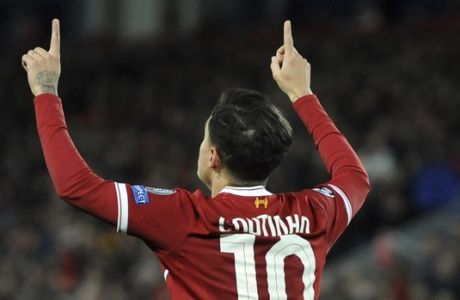 FILE - In this file photo dated Wednesday, Dec. 6, 2017, Liverpool's Philippe Coutinho celebrates after scoring during the Champions League soccer match between Liverpool and Spartak Moscow at Anfield in Liverpool, England.  Coutinho arrives at Barcelona soccer club Sunday Jan. 7, 2018, signed from Liverpool for a huge price tag and expected to continue the long line of Brazilian stars who have dazzled at Camp Nou. (AP Photo/Rui Vieira, FILE)