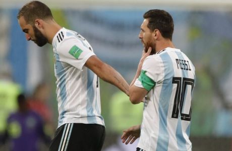 Argentina's Lionel Messi, right, talks to his teammate Gonzalo Higuain during the group D match between Argentina and Nigeria, at the 2018 soccer World Cup in the St. Petersburg Stadium in St. Petersburg, Russia, Tuesday, June 26, 2018. (AP Photo/Ricardo Mazalan)
