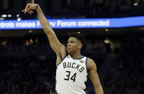 Milwaukee Bucks' Giannis Antetokounmpo reacts after making a shot during the second half of an NBA basketball game against the LA Clippers Thursday, March 28, 2019, in Milwaukee. The Bucks won 128-118. (AP Photo/Aaron Gash)
