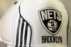 A hat bearing the new logo of the Brooklyn Nets is displayed during a news conference to unveil the new logos of the Brooklyn Nets in New York, Monday, April 30, 2012.  The Nets will be moving from New Jersey to the new Barclays Center in Brooklyn, New York for the 2012-2013 NBA basketball season. (AP Photo/Seth Wenig)