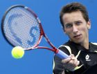 Sergiy Stakhovsky of Ukraine returns a ball to Lukasz Kubot of Poland during their second round match at the Australian Open tennis championships in Melbourne, Australia, Wednesday, Jan. 19, 2011.   (AP Photo/Vincent Thian)