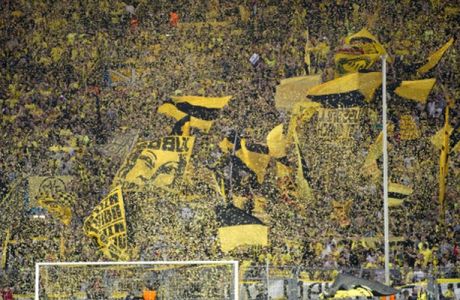 Dortmund's fans wave before the UEFA Champions League semi final first leg football match between Borussia Dortmund and Real Madrid on April 24, 2013 in Dortmund, western Germany. AFP PHOTO / ODD ANDERSEN