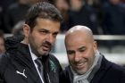 Ajax's Peter Bosz, right, and Panathinaikos' coach Andrea Stramaccioni talk prior to the Group G Europa League soccer match between Ajax and Panathinaikos at the ArenA stadium in Amsterdam, Netherlands, Thursday, Nov. 24, 2016. (AP Photo/Peter Dejong)