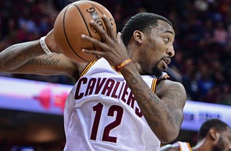 Cleveland Cavaliers Jordan McRae (12) secures a rebound in the second half of an NBA preseason basketball game against the Philadelphia 76ers, Saturday, Oct. 8, 2016, in Cleveland. The Cavaliers won 108-105. (AP Photo/DavidDermer)