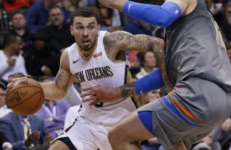 New Orleans Pelicans guard Mike James, left, drives against Oklahoma City Thunder center Steven Adams during the first half of an NBA basketball game in Oklahoma City, Friday, Feb. 2, 2018. (AP Photo/Sue Ogrocki)