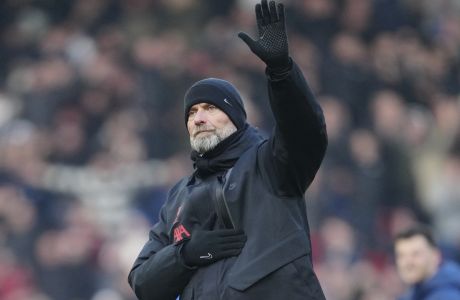 Liverpool's manager Jurgen Klopp waves after the English Premier League soccer match between Liverpool and Chelsea at Anfield stadium in Liverpool, England, Saturday, Jan. 21, 2023. (AP Photo/Jon Super)