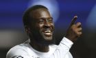 Napoli's Tanguy Ndombele celebrates after scoring his side's third goal during the Champions League group A soccer match between Rangers and Napoli at the Ibrox stadium in Glasgow, Scotland, Wednesday, Sept. 14, 2022. (AP Photo/Scott Heppell)