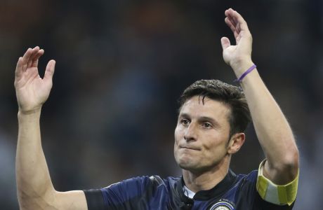 Inter Milan's Javier Zanetti,of Argentina greets his fans  at the end of the Serie A soccer match between Inter Milan and Lazio at the San Siro stadium in Milan, Italy, Saturday, May 10, 2014. Zanetti will retire after 19 seasons at Inter, and the stadium was sold out as fans packed in to bid farewell to their 40-year-old captain. (AP Photo/Antonio Calanni)