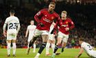 Manchester United's Marcus Rashford celebrates after scoring his side's second goal during the English Premier League soccer match between Manchester United and Tottenham Hotspur at the Old Trafford stadium in Manchester, England, Sunday, Jan.14, 2024. (AP Photo/Dave Thompson)