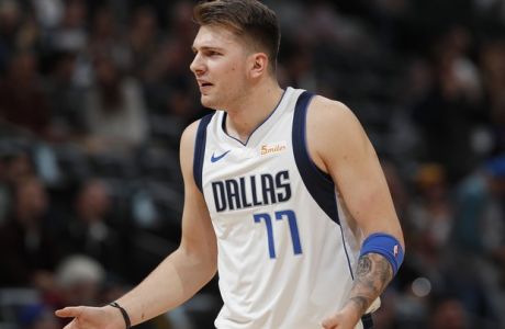 Dallas Mavericks forward Luka Doncic argues for a call in the first half of an NBA basketball game against the Denver Nuggets Tuesday, Dec. 18, 2018, in Denver. (AP Photo/David Zalubowski)