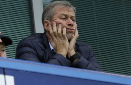 FILE - In this file photo dated Saturday, Dec. 19, 2015, Chelsea soccer club owner Roman Abramovich sits in his box before the English Premier League soccer match between Chelsea and Sunderland at Stamford Bridge stadium in London. (AP Photo/Matt Dunham, File)