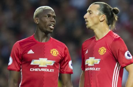 Manchester United's Zlatan Ibrahiovic, right, and Paul Pogba wait for a corner kick to be taken during the English Premier League soccer match between Manchester United and Southampton at Old Trafford Stadium, Manchester, England, Friday, Aug. 19, 2016. (AP Photo/Jon Super)