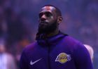 Los Angeles Lakers' LeBron James listens to the national anthem before an NBA basketball game against the Memphis Grizzlies Sunday, Dec. 23, 2018, in Los Angeles. (AP Photo/Marcio Jose Sanchez)