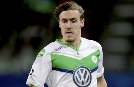 FILE - Wolfsburg's then player Max Kruse during the Champions League round of sixteen 2nd leg soccer match between VfL Wolfsburg and KAA Gent in Wolfsburg, Germany, Tuesday, March 8, 2016. After signing Max Kruse again German Bundeliga team Wolfsburg is banking on a victory against last-place Greuther Fürth on Sunday after failing to win any of its last nine Bundesliga games. Wolfsburg clinched fourth place and qualification for Europes premiere competition last season, now it's just two points above the relegation zone after 20 rounds of the league.(AP Photo/Michael Sohn,file)