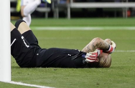Liverpool goalkeeper Loris Karius reacts after Real Madrid's Gareth Bale scored during the Champions League Final soccer match between Real Madrid and Liverpool at the Olimpiyskiy Stadium in Kiev, Ukraine, Saturday, May 26, 2018. (AP Photo/Sergei Grits)