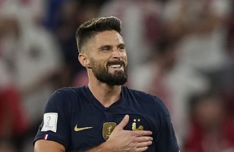 France's Olivier Giroud celebrates scoring his side's first goal during the World Cup round of 16 soccer match between France and Poland, at the Al Thumama Stadium in Doha, Qatar, Sunday, Dec. 4, 2022. (AP Photo/Martin Meissner)