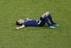 Japan's Shinji Kagawa lies on the pitch at the end of the round of 16 match between Belgium and Japan at the 2018 soccer World Cup in the Rostov Arena, in Rostov-on-Don, Russia, Monday, July 2, 2018. (AP Photo/Hassan Ammar)