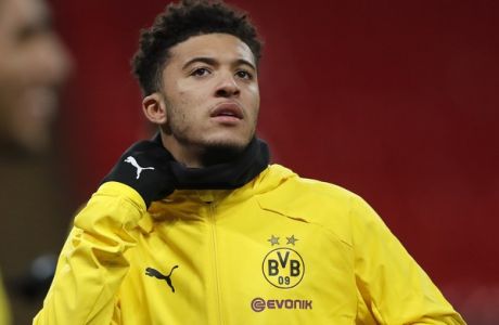Dortmund's Jadon Sancho warms up during a training session one day ahead of the Champions League round of 16 first leg soccer match between Tottenham Hotspur and Borussia Dortmund at Wembley Stadium in London, Tuesday, Feb. 12, 2019.(AP Photo/Frank Augstein)
