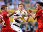 Leverkusen's Chilean midfielder Charles Mariano Arnguiz (R) and Moenchengladbach's midfielder Andre Hahn vie for the ball during the German first division Bundesliga football match between Borussia Moenchengladbach and Bayer 04 Leverkusen, at the Borussia Park in Moenchengladbach, western Germany, on May 7, 2016. / AFP / Sascha SCHRMANN / RESTRICTIONS: DURING MATCH TIME: DFL RULES TO LIMIT THE ONLINE USAGE TO 15 PICTURES PER MATCH AND FORBID IMAGE SEQUENCES TO SIMULATE VIDEO. == RESTRICTED TO EDITORIAL USE == FOR FURTHER QUERIES PLEASE CONTACT DFL DIRECTLY AT + 49 69 650050
        (Photo credit should read SASCHA SCHURMANN/AFP/Getty Images)