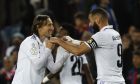 Real Madrid's Karim Benzema, right, celebrates with his teammate Luka Modric after scoring his side's third goal during the Spanish Copa del Rey semifinal, second leg soccer match between Barcelona and Real Madrid at the Camp Nou stadium in Barcelona, Spain, Wednesday, April 5, 2023. (AP Photo/Joan Monfort)
