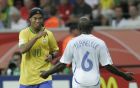 Brazil's Ronaldinho gestures to France's Claude Makelele during the Brazil v France quarterfinal soccer match at the World Cup stadium in Frankfurt, Germany, Saturday, July 1, 2006.  (AP Photo/Christophe Ena) **MOBILE/PDA USAGE OUT **