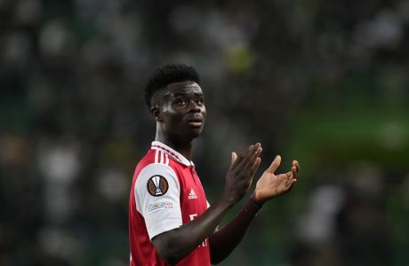 Arsenal's Bukayo Saka waves fans at the end of the Europa League round of 16, first leg, soccer match between Sporting CP and Arsenal at the Alvalade stadium in Lisbon, Thursday, March 9, 2023. (AP Photo/Armando Franca)