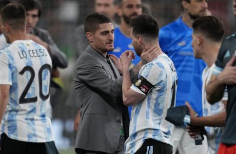 Argentina's Lionel Messi, right, talks with Italy's Marco Verratti at the end of the Finalissima soccer match between Italy and Argentina at Wembley Stadium in London , Wednesday, June 1, 2022. (AP Photo/Matt Dunham)