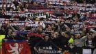 Lyon's fans celebrate advancing to the next rounds after the Europa League round of 16 second leg soccer match between Roma and Lyon, in Rome's Olympic stadium, Thursday, March 16, 2017. (AP Photo/Andrew Medichini)