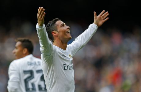 Real Madrid's Cristiano Ronaldo celebrates after scoring a goal against Celta during a Spanish La Liga soccer match between Real Madrid and Celta Vigo at the Santiago Bernabeu stadium in Madrid, Saturday, March 5, 2016. Ronaldo scored four goals in Real Madrid's 7-1 victory.  (AP Photo/Francisco Seco)