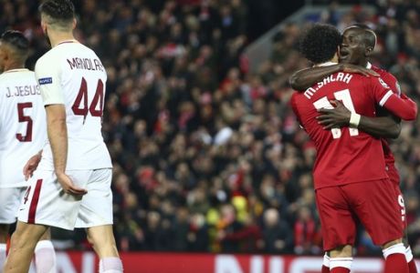 Liverpool's Sadio Mane, right, celebrates with Mohamed Salah after scoring his side's third goal during the Champions League semifinal, first leg, soccer match between Liverpool and AS Roma at Anfield Stadium, Liverpool, England, Tuesday, April 24, 2018. (AP Photo/Dave Thompson)