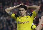 FILE - In this file photo dated Tuesday, Feb. 14, 2017, Dortmund's Marc Bartra reacts during the Champions League round of 16, first leg, soccer match between Benfica and Borussia Dortmund at the Luz stadium in Lisbon. Borussia Dortmund said Tuesday April 11, 2017, defender Marc Bartra was injured in an explosion near team bus and is currently in a hospital. (AP Photo/Armando Franca, FILE)
