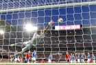 Italy goalkeeper Gianluigi Buffon fails to stop a goal from Spain's Isco to open the score during the World Cup Group G qualifying soccer match between Spain and Italy at the Santiago Bernabeu Stadium in Madrid, Saturday Sept. 2, 2017. (AP Photo/Paul White)